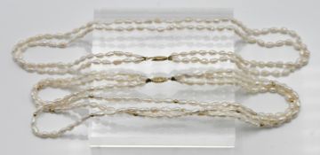 Two oriental seed pearl necklaces three row with gold bead insets, approx. length: 40cm, 14kt gold