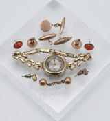A 9ct gold watch on a rolled gold bracelet together with earrings etc.