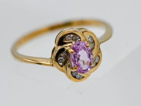 9ct yellow gold pink sapphire & diamond oval shaped cluster ring Central 6.00 x 4.00mm oval cut pink