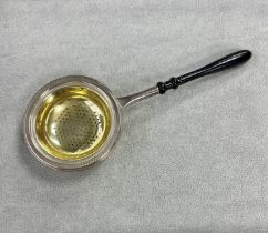 Tea strainer from L J MIllington, manufactured for the Millenium year 2000