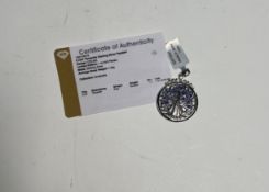 A silver and tanzanite pendant, with certificate of authenticity.