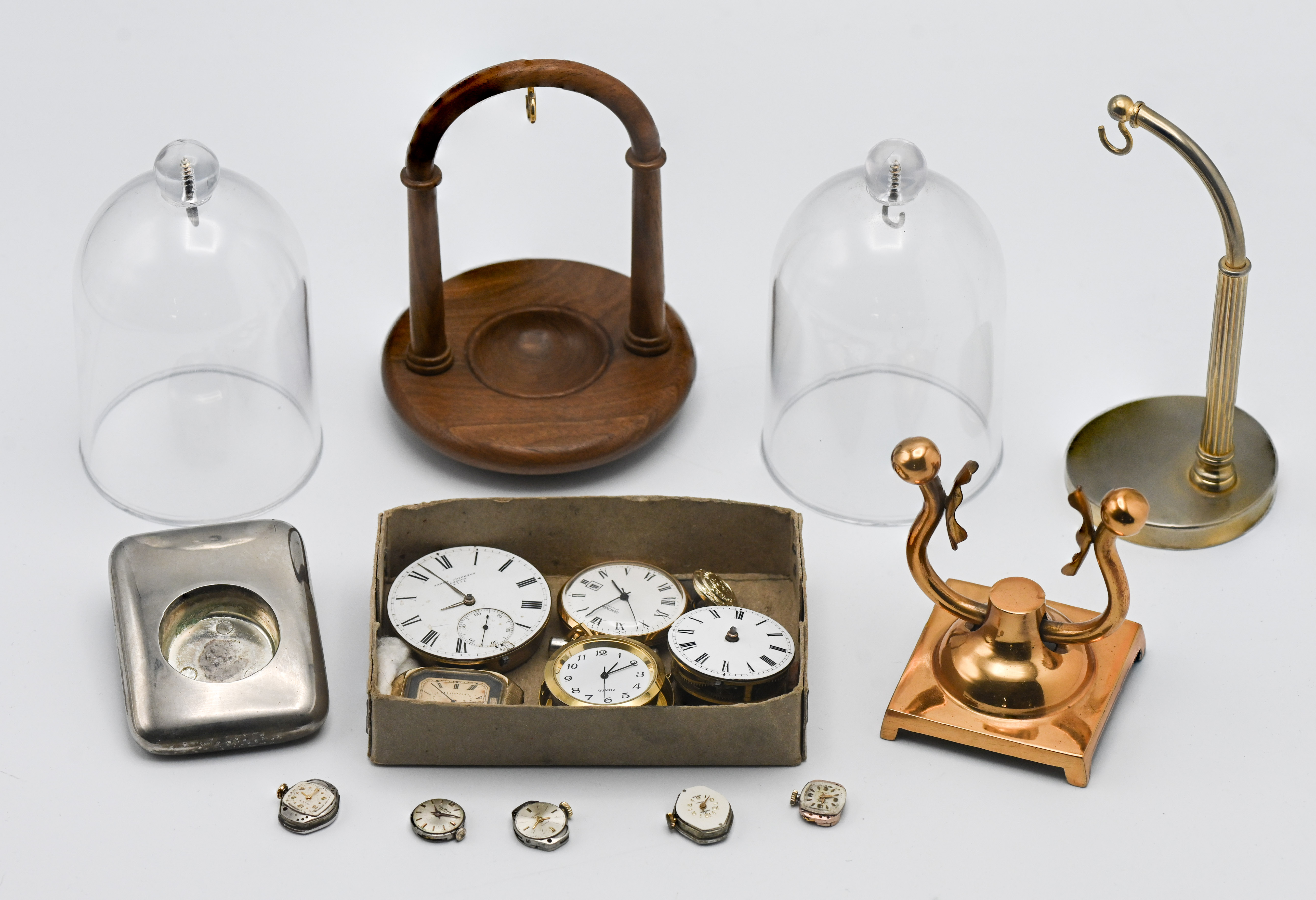 A mixed collection including pocket watch stands, odd pocket watches including James Crichton,