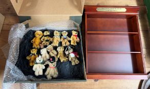 12 miniature 12cm teddy bears with a wooden display shelf unit.
