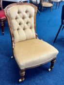 A late Victorian upholstered and walnut framed nursing chair