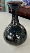 A studio pottery vase. Signed 'West', to the base, height 30cm.