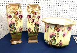 A pair early 20th century English vases of Oriental design together with a matching jardinière