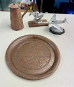 An Art Nouveau copper jug, 'Johnnie Walker' copper advertising plate etc.
