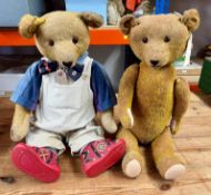 Two teddy bears; one 65cm 1930's woodwool filled teddy with replacement eyes dressed by Witney and