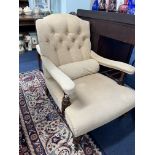 A late 19th century upholstered library chair on turned legs and castors.