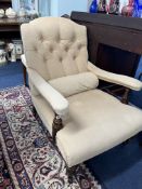 A late 19th century upholstered library chair on turned legs and castors.