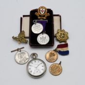 A small mixed collection to include military badges, King George VI coronation medal, medal to