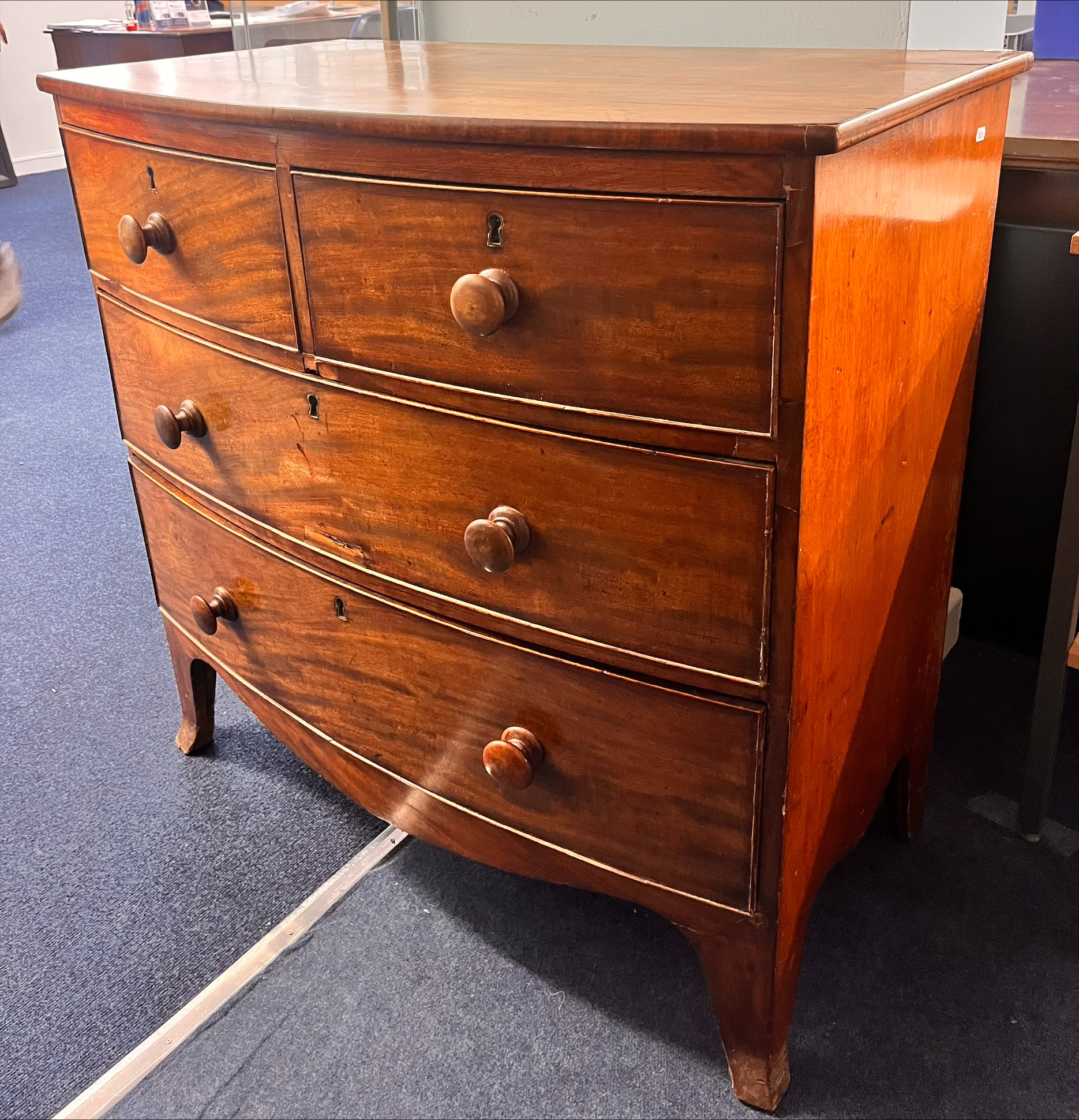 A Victorian mahogany bow-fronted chest of drawers, fitted with two long and two short splayed