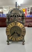A 20th century Smith's brass lantern clock, with pierced dolphins decoration, number EW264/53,
