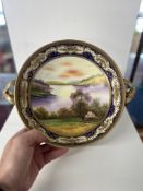 Noritake, Japanese porcelain comport on stand the bowl decorated with a landscape river scene with
