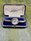 A vintage 9ct gold ladies wristwatch, Swiss movement with Arabic numerals and a 'red twelve',
