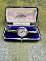 A vintage 9ct gold ladies wristwatch, Swiss movement with Arabic numerals and a 'red twelve',