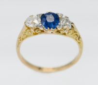 An 18ct sapphire and diamond three stone ring, size O/P.