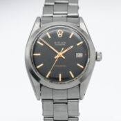 Rolex, an Oysterdate Precision stainless steel wristwatch with black baton dial, running. Case
