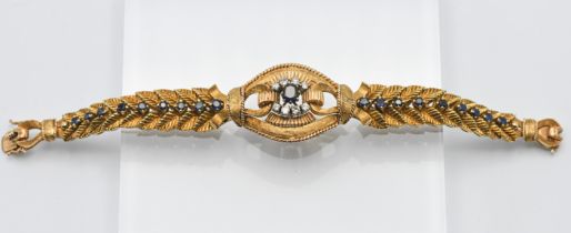 An impressive 18ct yellow gold sapphire and diamond feathered construction design cuff bracelet