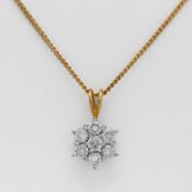 An 18ct diamond pendant and chain.