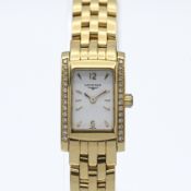 Longines, a ladies Dolce Vita 18ct gold and diamond set bezel, quartz movement, with a white gold