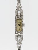 A ladies 1930's diamond set cocktail watch, platinum case, mechanical Swiss movement, classic Arabic