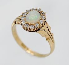 An 18ct opal and diamond cluster ring, size P.