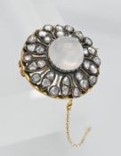 A moonstone and diamond circular brooch, diameter 25mm.