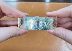 A silver and engraved bangle, 58.20g