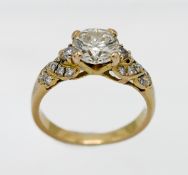 An 18ct yellow gold diamond ring, centre stone approx. 1.30ct modern brilliant cut diamond