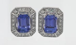 A pair of diamond and tanzanite earrings with copy of gemstone certificate indicating diamond weight