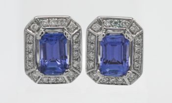 A pair of diamond and tanzanite earrings with copy of gemstone certificate indicating diamond weight