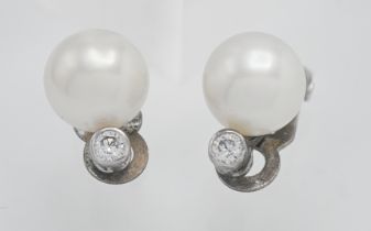 A pair of pearl and diamond clip on earrings (The Pearl Company)