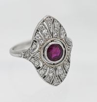 A 1920's platinum ruby and diamond cluster ring, size J.
