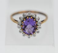 A 9ct amethyst and diamond cluster ring, size N.