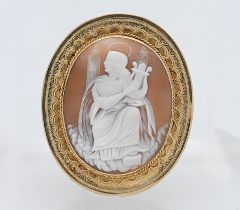 An antique gold cameo brooch, measuring 67mm x 55mm.