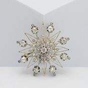 An impressive diamond star brooch and pendant. Diameter approx. 40mm.