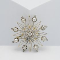 An impressive diamond star brooch and pendant. Diameter approx. 40mm.