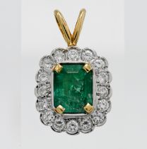 An 18ct emerald and diamond pendant, measuring approx. 16 x 13mm.