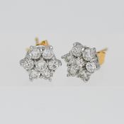 A pair of 18ct diamond cluster earrings.