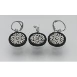 A stylish diamond and black onyx pendant and earrings set.