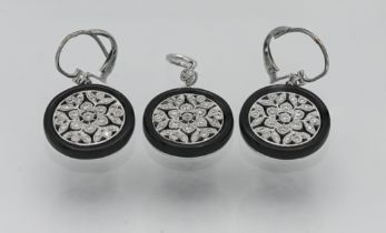 A stylish diamond and black onyx pendant and earrings set.