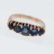 A five stone graduated set sapphire ring, claw carved head (no hallmark), size N.