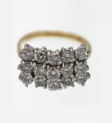 An 18ct yellow and white gold triple row diamond set ring, set with fifteen modern brilliant cut