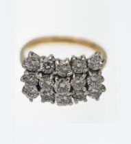 An 18ct yellow and white gold triple row diamond set ring, set with fifteen modern brilliant cut