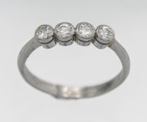 A platinum four stone diamond set ring, size Q/R