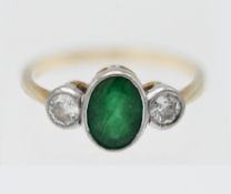 A 18ct gold emerald and diamond three stone ring, the emerald approx. 1.25ct, the diamonds approx.