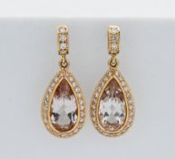 A pair of 18ct diamond and light topaz pear drop earrings, stamped 'HPB'.