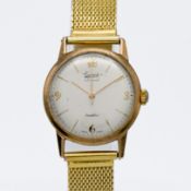 A 9ct yellow gold Everite manual wind wristwatch, seventeen jewels, Incabloc. Gold plated bracelet.