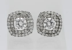 A pair of fine 18ct diamond cluster earrings. Approx 11mm squared